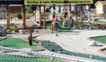 Golfing under the 14' x 48' giant billboard @ White Lake Speedway Inc.